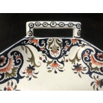 A hand painted ceramic dish with two handles