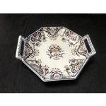 A hand painted ceramic dish with two handles