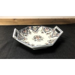 A hand painted ceramic dish with two handles
