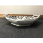 A hand painted ceramic dish with two handles