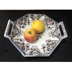 A hand painted ceramic dish with two handles