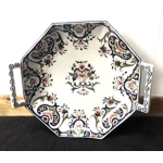 A hand painted ceramic dish with two handles