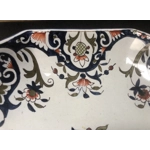 A hand painted ceramic dish with two handles