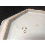 A hand painted ceramic dish with two handles