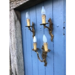 A trio of fine old French wall sconces lamps in a mix of brass/cast bronze in a rococo style: one two-lamp and two single-lamp wall sconces