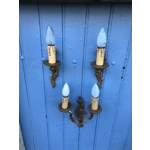A trio of fine old French wall sconces lamps in a mix of brass/cast bronze in a rococo style: one two-lamp and two single-lamp wall sconces
