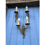 A trio of fine old French wall sconces lamps in a mix of brass/cast bronze in a rococo style: one two-lamp and two single-lamp wall sconces