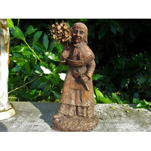 Folk art figurine of an old ..
