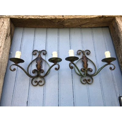A pair of two-arm early 20th century French wrought iron and tole wall lights wall sconces of Classic design,worn green patina green France