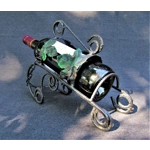 French traditional vintage metal wine bottle holder decorated with a green grape leaf.