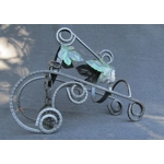 French traditional vintage metal wine bottle holder decorated with a green grape leaf.