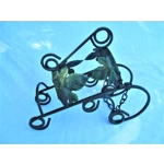 French traditional vintage metal wine bottle holder decorated with a green grape leaf.