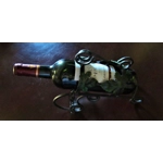 French traditional vintage metal wine bottle holder decorated with a green grape leaf.