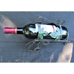 French traditional vintage metal wine bottle holder decorated with a green grape leaf.