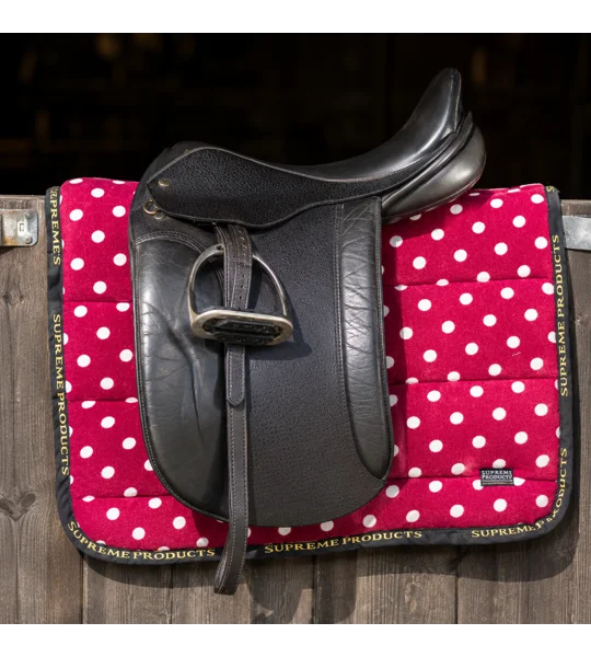 Supreme Products Dotty Fleece Saddle Pad Rich Raspberry luxury fleece horse saddle pad with black piping and gold branding for everyday riding, training and competitions