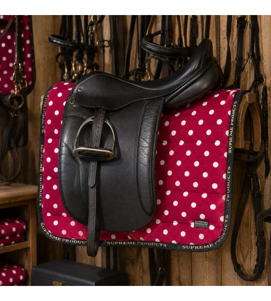 Supreme Products Dotty Fleece Saddle Pad Rich Raspberry luxury fleece horse saddle pad with black piping and gold branding for everyday riding, training and competitions
