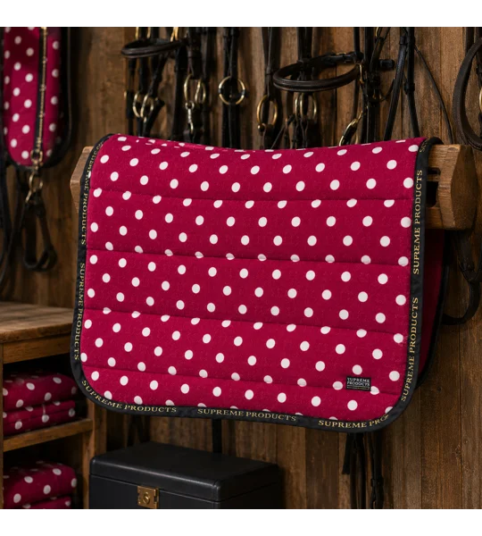 Supreme Products Dotty Fleece Saddle Pad Rich Raspberry luxury fleece horse saddle pad with black piping and gold branding for everyday riding, training and competitions