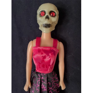 Red Eyed Skull Doll