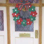 Dolls House Miniature Christmas Wreath with Christmas Flowers and a Tartan Bow 1:12 Scale
