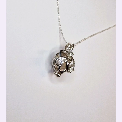Forget Me Knot Cage Pendant