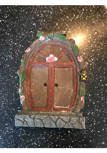 Latex mould for fairy door surrounded by flowers