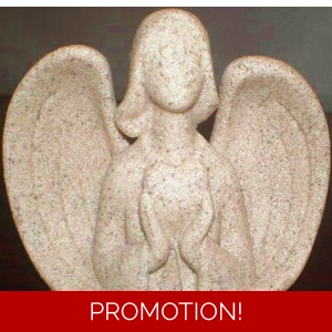Angel figure holding heart