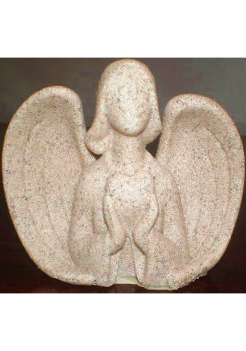 Angel figure holding heart