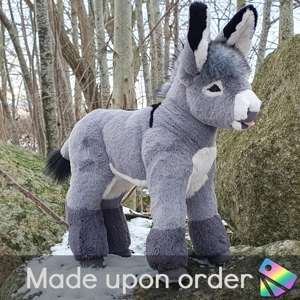 Miniature donkey with small cross