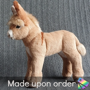 Miniature donkey with l..