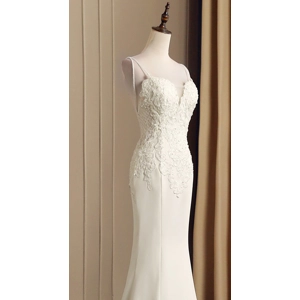 Fishtail trailing French satin slip on wedding dress.