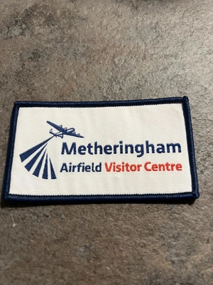 Printed material badge