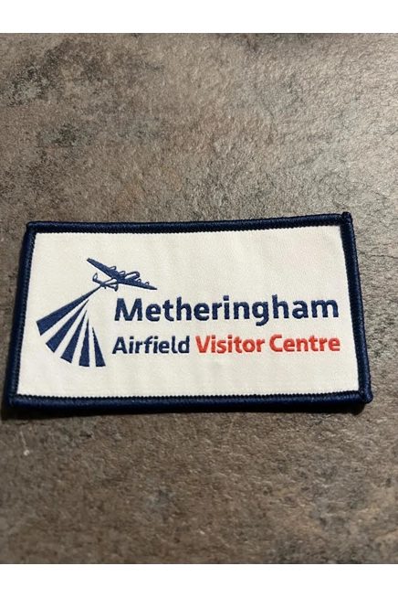 Printed material badge