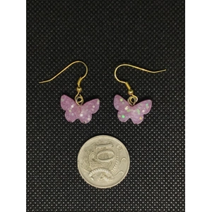 Resin pink glitter butterfly pierced earrings