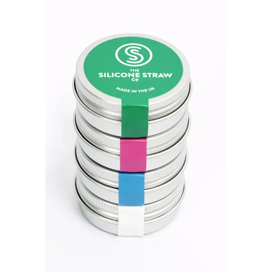 A small stack of reusbale straws in travel tins
