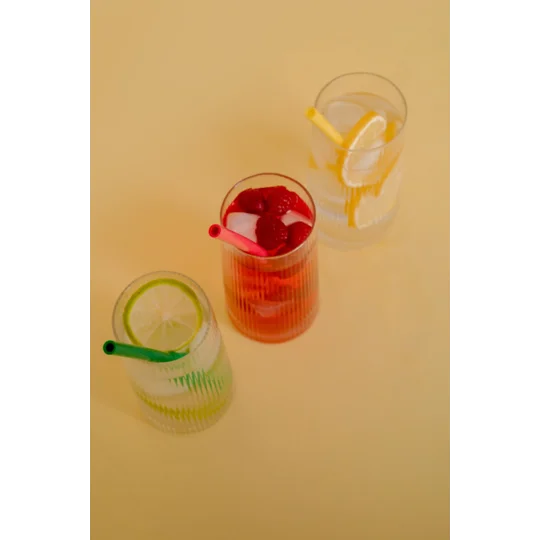 three reusable straws in three drinks
