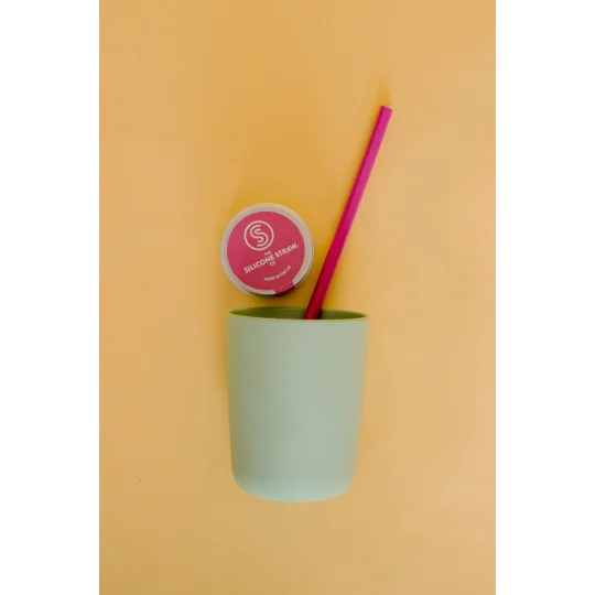 Colour image of a silicone straw in a child’s cup