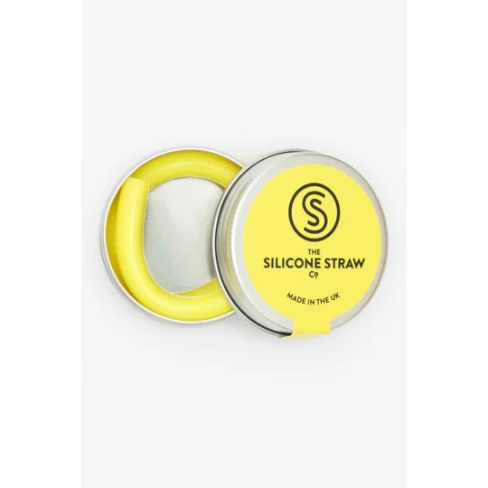 A yellow silicone straw inside a tin