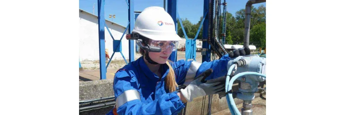 A photo of an industrial engineer at work and wearing a realwear headset