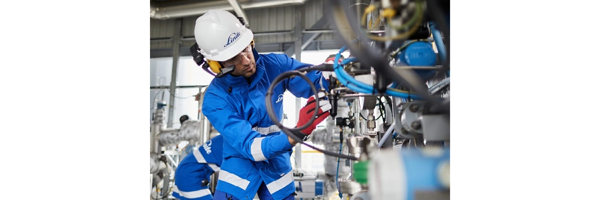 A photo of an industrial engineer at work and wearing a realwear headset