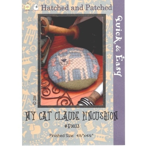 Front cover of stitchery pattern for a pin cushion featuring a cat design.