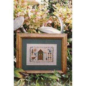 Framed cross stitch pattern featuring a country garden theme.