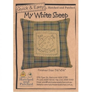 Front cover of stitchery pattern for a cushion featuring a sheep design.
