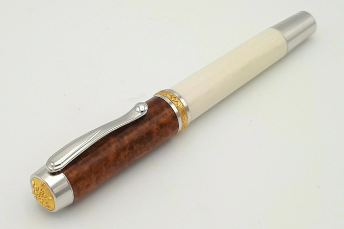 SR1 rollerball in synthetic ivory and amboyna burr SR1 rollerball in synthetic ivory and amboyna burr