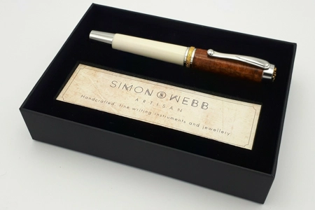 SR1 rollerball in synthetic ivory and amboyna burr SR1 rollerball in synthetic ivory and amboyna burr