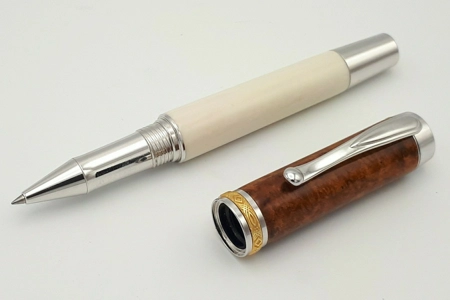 SR1 rollerball in synthetic ivory and amboyna burr SR1 rollerball in synthetic ivory and amboyna burr