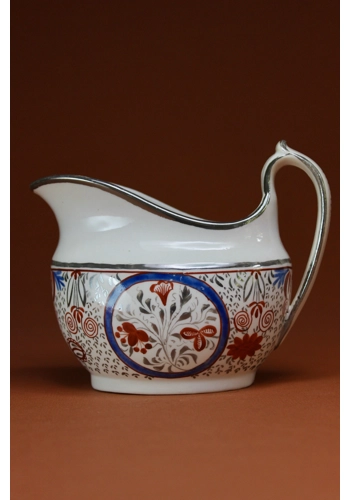 Thomas Wolfe Creamer with red blue and silver decoration