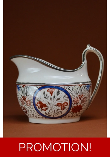 Thomas Wolfe Creamer with red blue and silver decoration