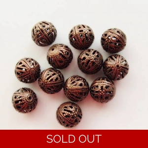 12, 10mm metal filigree beads, antique copper plated.
