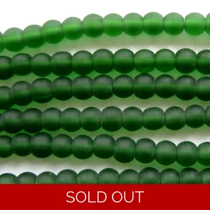 Strand 30 Indian glass beads, 6mm round, frosted emerald green
