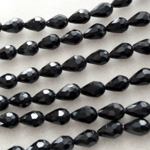 Strand of 12 faceted crystal glass beads, black, 12mm x 8mm